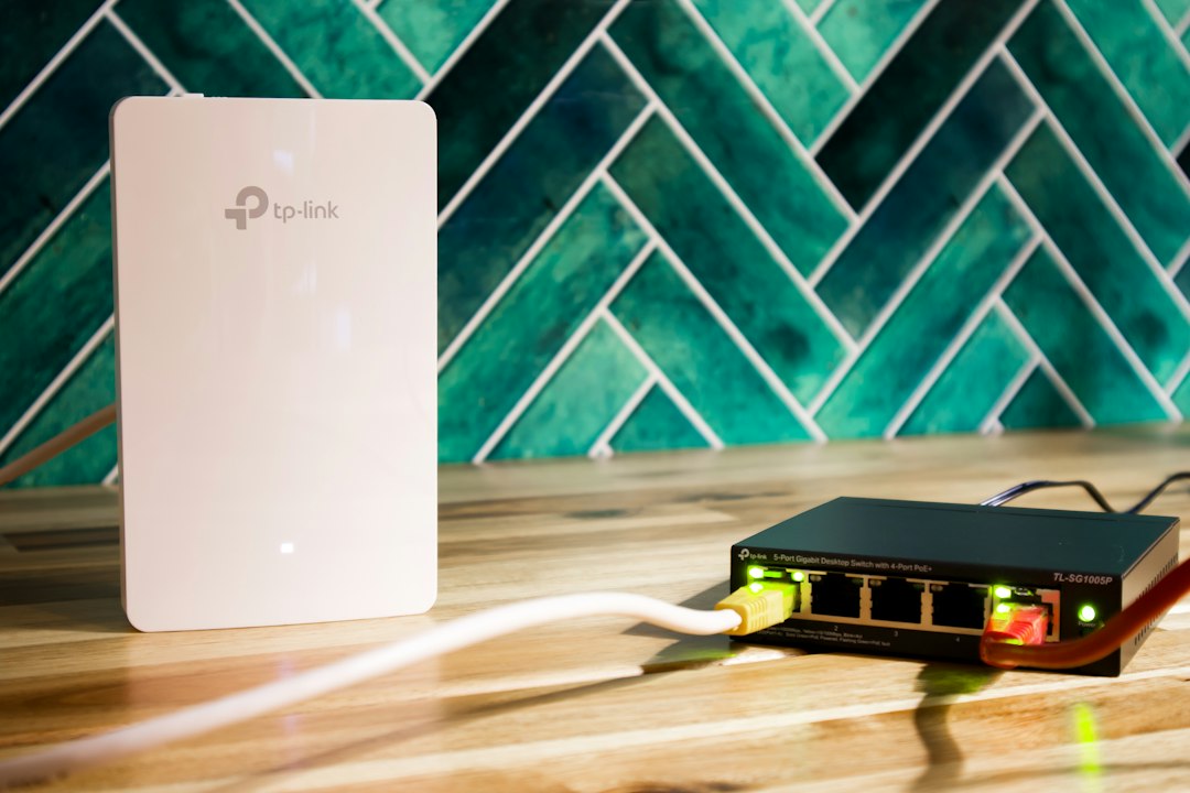 A Wi-Fi router and network switch on a shelf