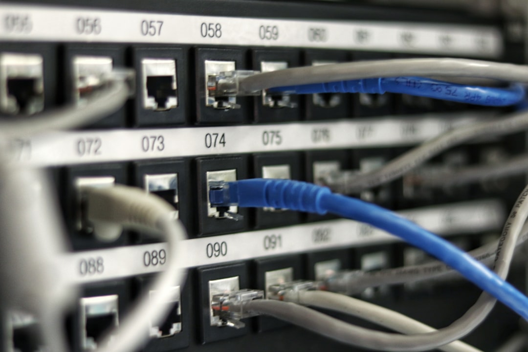 Ethernet cable plugged into a network port — a wired backhaul beats a wireless one