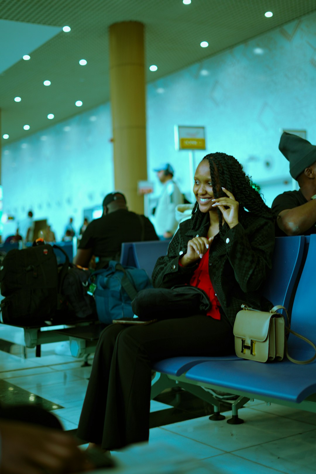 Traveler smiling at an airport terminal